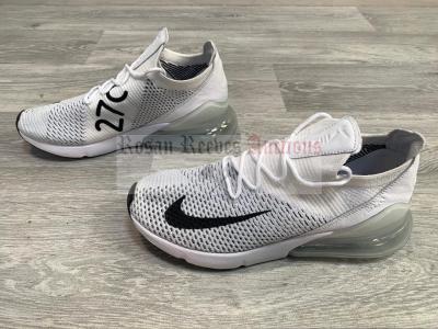 A pair of Nike Air Max 270 FlyKnit white black trainers UK 7.5