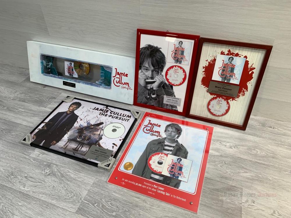 A collection of assorted framed and glazed Jamie Cullum CD plaques/awards to commemorate sales for 'Catching Tales' and 'The Pursuit' albums