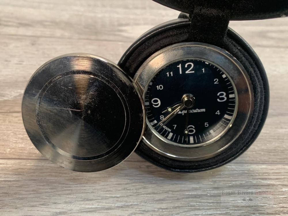 *An Aquascutum small alarm clock in case and an Aquascutum silver pen ...