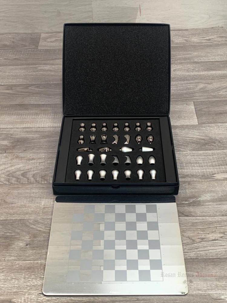 An Aquascutum contemporary chrome chess set with box