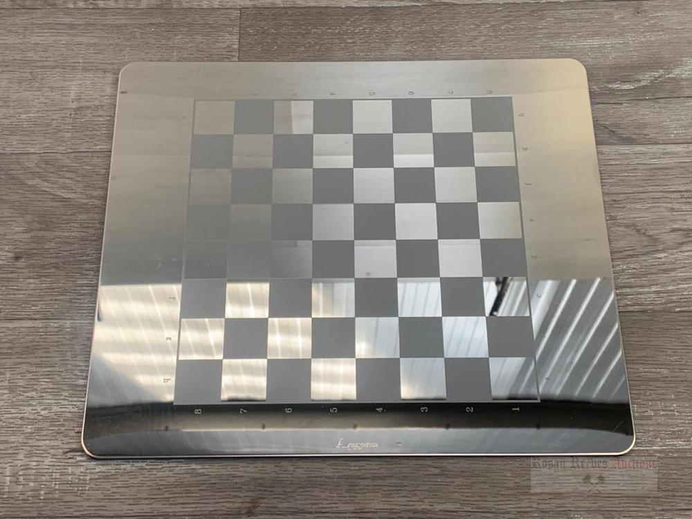 An Aquascutum contemporary chrome chess set with box