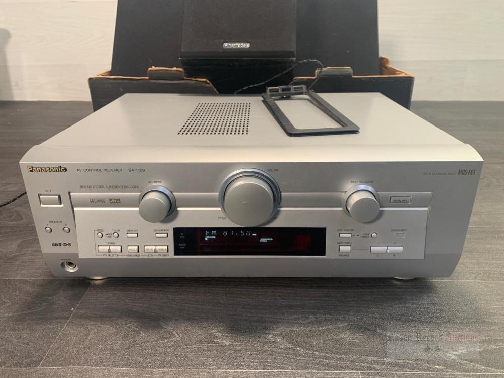 *A Panasonic SA-HE9 AV control receiver and a crate containing a pair ...