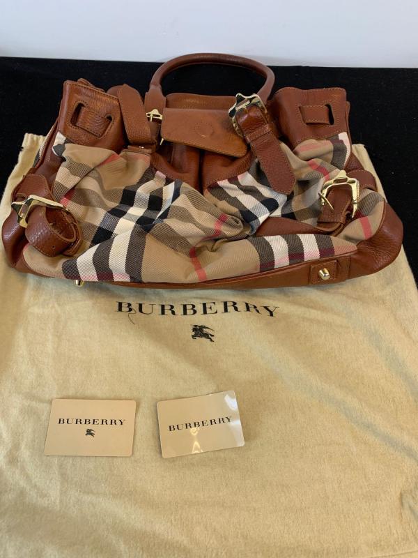 A Burberry canvas fabric and brown leather ladies bag with tags and dust  cover